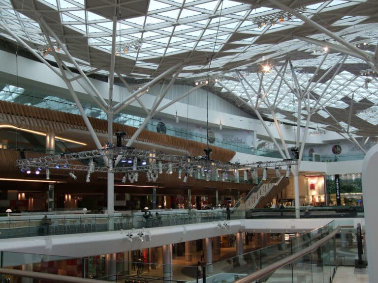 Interior of Westfield London shopping centre with cinema signage